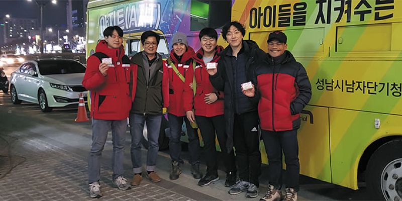 Fr. Vincenzo and his team with the bus